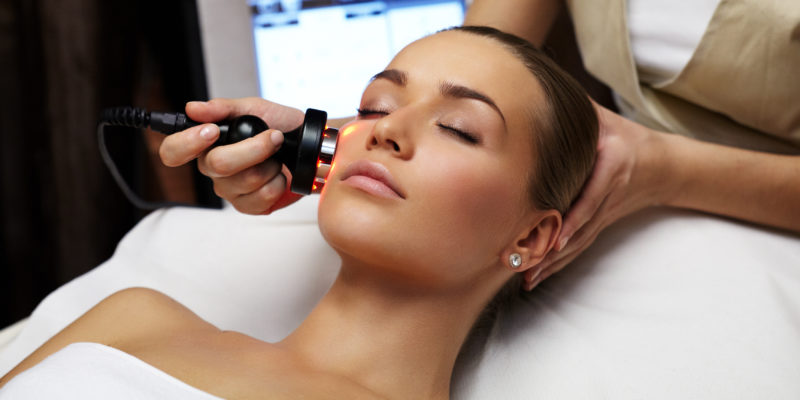 Beauty treatment Woman lies on a table in a beauty spa getting a treatment